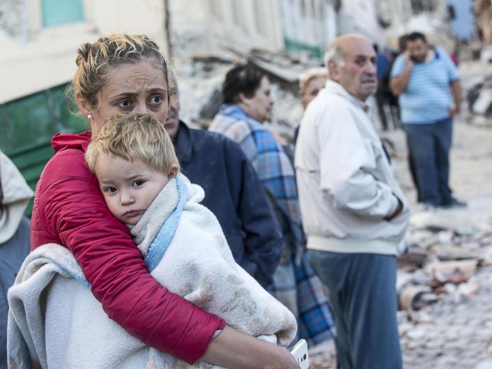 Massimo Percossi  EPAA mother embraces her son in Amatrice Italy Aug. 24 2016 following a earthquake