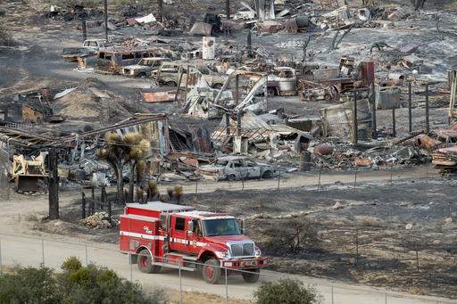 Homes burned by California fire; teams look for more damage