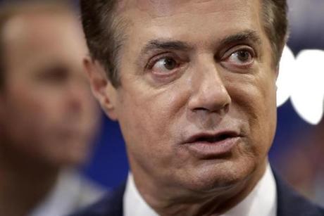 Trump Campaign Chairman Paul Manafort talks to reporters on the floor of the Republican National Convention at Quicken Loans Arena Sunday