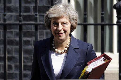 Britain's Prime Minister Theresa May leaves 10 Downing street for Prime Ministers Questions at the House of Parliament in London. ﻿Officials at May's Downing Street office say May is bringing her Cabinet together