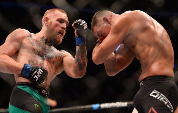 McGregor's uppercut falls short of Nate Diaz's full guard in a classic display of MMA striking