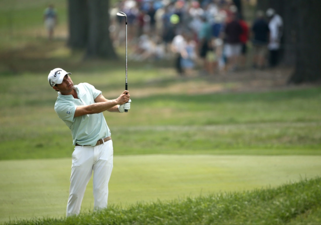 Kevin Kisner watches his approach shot to the 18th hole during the third round of the PGA Championship golf tournament at Baltusrol Golf Club in Springfield N.J. Saturday