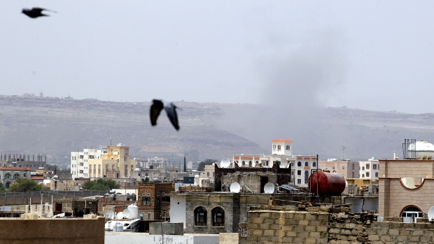 Smoke billows rise above the city following a Saudi-led airstrike targeting a Houthi position in Sanaa Yemen. According to reports several were killed and others wounded when a Saudi-led airstrike targeted a hospital operated by Doctors Without Borders