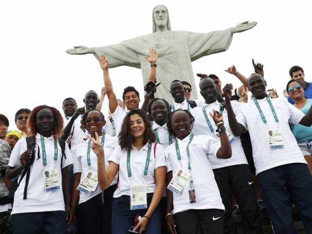 Members of the Olympic refugee team including Yusra Mardini from Syria pose in front of Christ the Redeemer