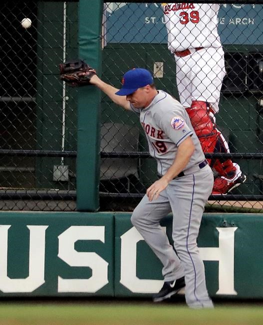 New York Mets right fielder Jay Bruce cannot catch a solo home run by St. Louis Cardinals&#39 Matt Carpenter during the first inning of a baseball game Wednesday Aug. 24 2016 in St. Louis