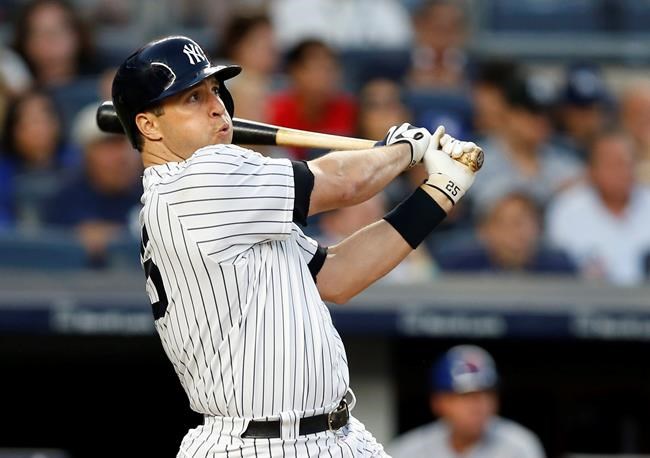 New York Yankees&#39 Mark Teixeira watches his three-run home run off New York Mets starting pitcher Steven Matz during the second inning of a baseball game Wednesday Aug. 3 2016 in New York