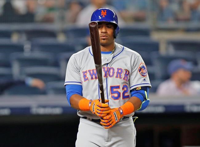 New York Mets&#39 Yoenis Cespedes looks at his bat during his ninth-inning at-bat in which he struck out in the Mets&#39 9-5 loss to the New York Yankees in a baseball game Wednesday Aug. 3 2016 in New York