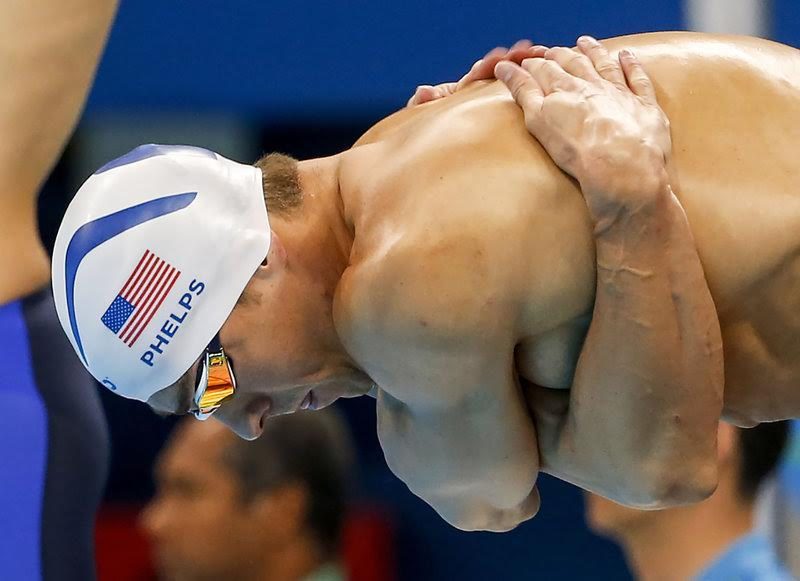 Michael PHELPS of the United States of America prepares himself before competing in the men's 200m Butterfly Heats