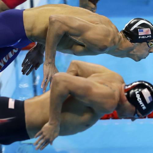 Michael Phelps top and United States&#039 Ryan Lochte compete in a semifinal of the men's 200-meter individual medley during the swimming competitions at the 2016 Summer Olympics Wednesday Aug. 10 2016 in Rio de Jan