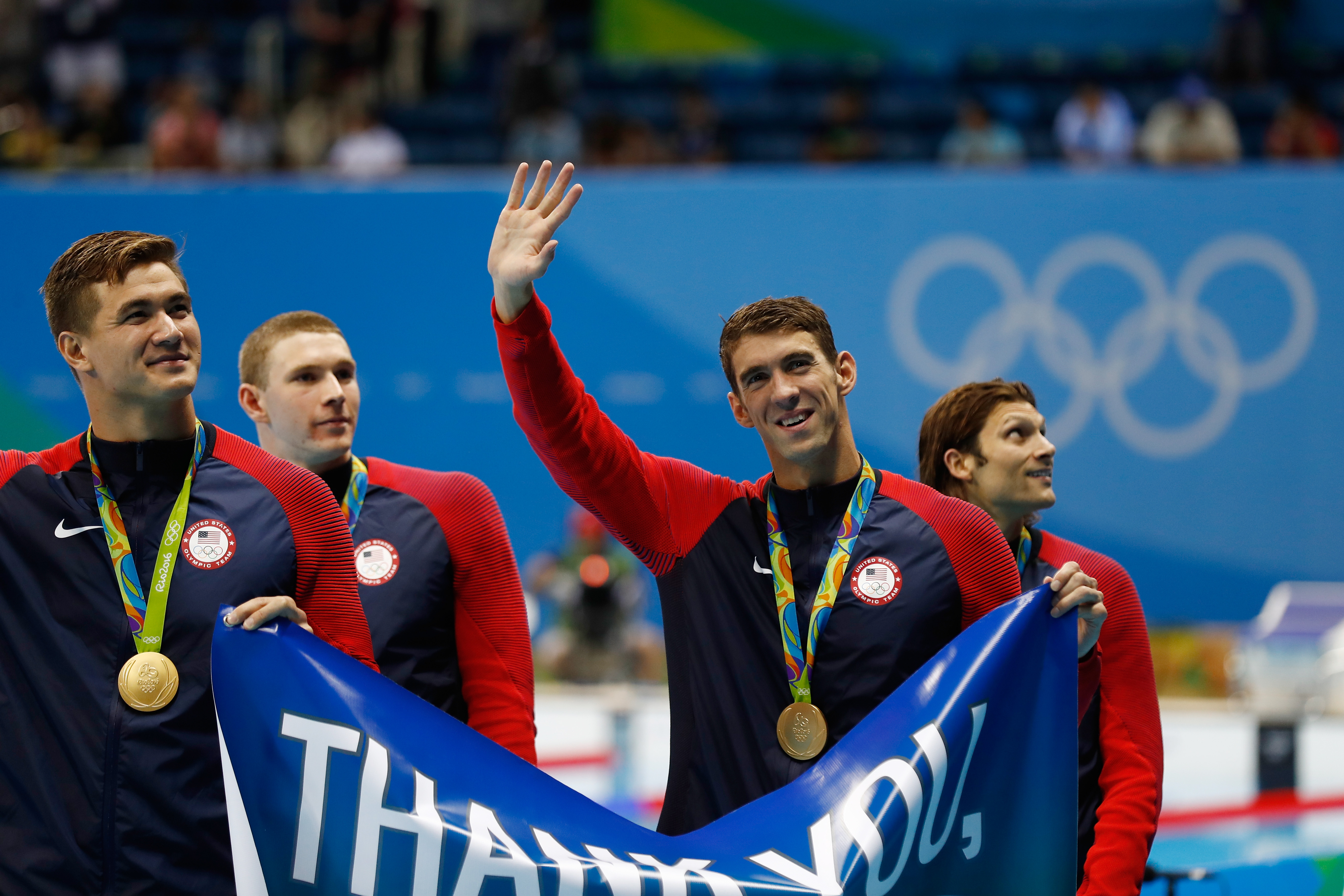 Gold medalist Michael Phelps of the United States waves to the crowd during the medal ceremony for the Men's 4 x 100m Medley Relay Final on Day 8 of the Rio 2016 Olympic Games at the Olympic Aquatics Stadium