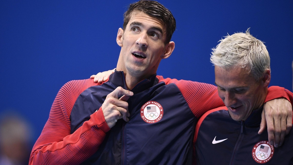 Michael Phelps and Ryan Lochte celebrate on the podium after they won the Men's 4x200m Freestyle Relay Final earlier in the Rio Olympics