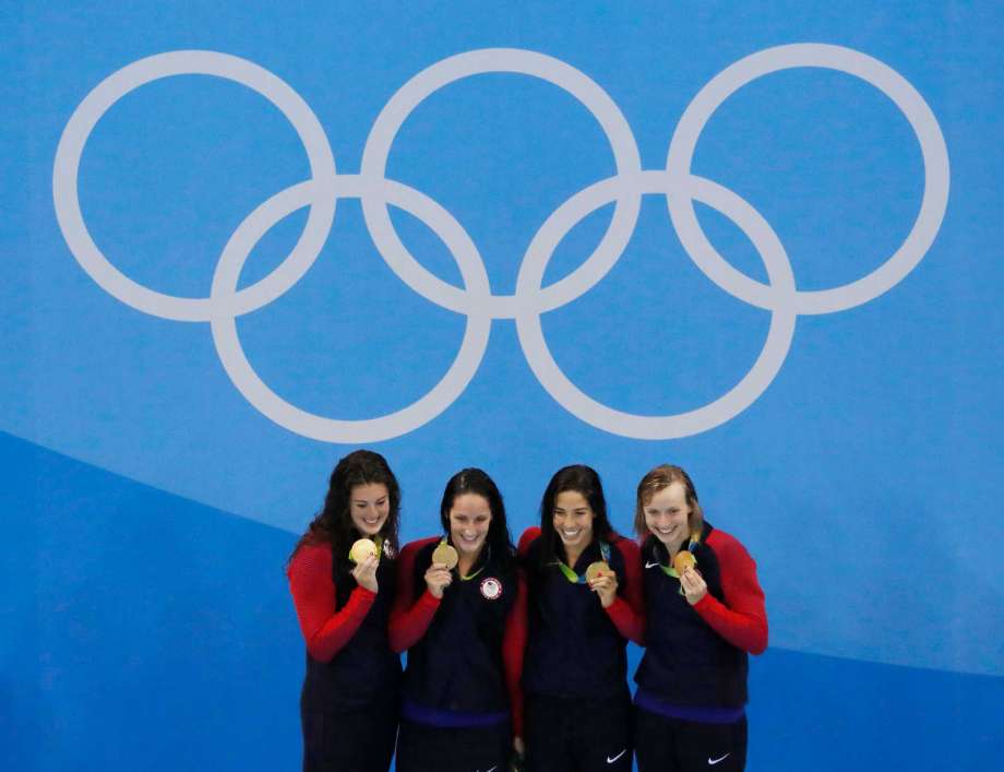 United States Allison Schmitt Leah Smith Maya Dirado and Katie Ledecky celebrate after winning agold medal in the 4 x 200m freestyle relay finals during to the swimming competitions at the 2016 Summer Olympics Thursday Aug. 11 2016 in Rio de Janeir