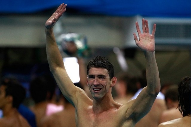 Michael Phelps of the United States celebrates on the podium during the medal ceremony. Getty