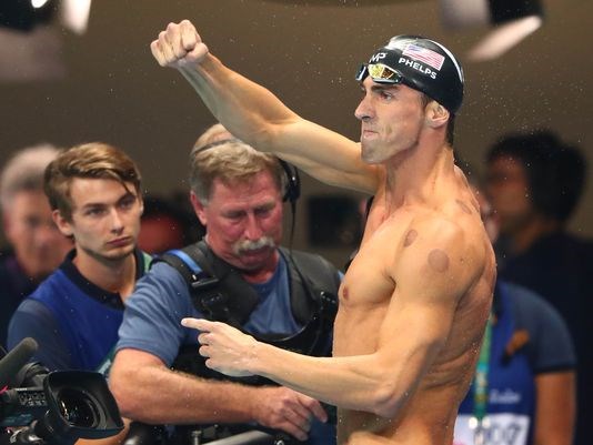 Michael Phelps reacts after winning the men's 200-meter butterfly