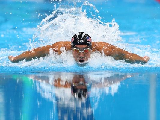 Michael Phelps swims during the men's 100-meter butterfly semifinal