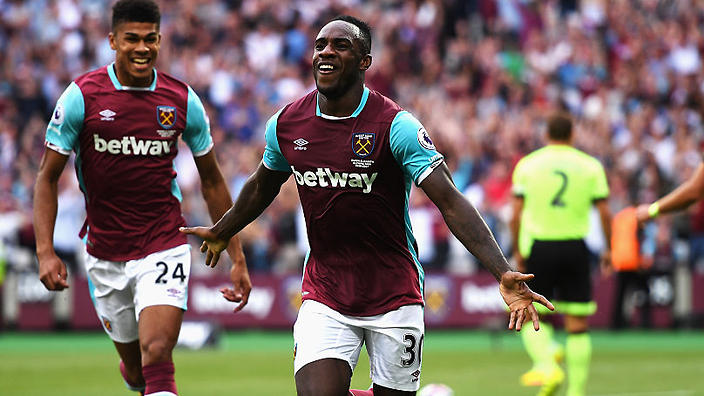 Michail Antonio celebrates his goal with teammates Ashley Fletcher and Sam Byram