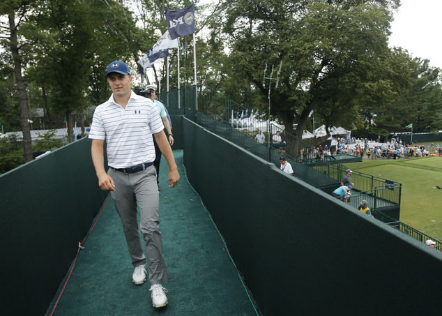 Jordan Spieth walks off the course during a weather delay in the third round of the PGA Championship golf tournament at Baltusrol Golf Club in Springfield N