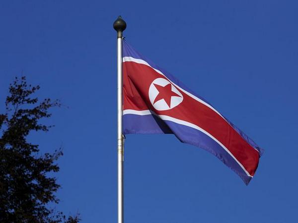 Korean flag flies on a mast at the Permanent Mission of North Korea in Geneva