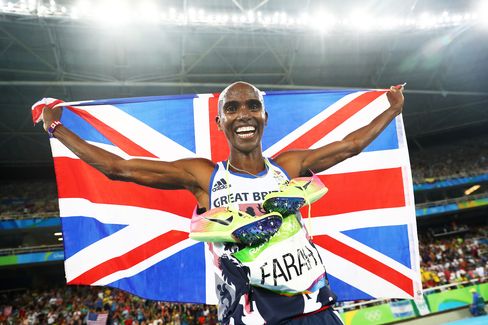 Mo Farah celebrates after winning gold in the men’s 5000 meter final