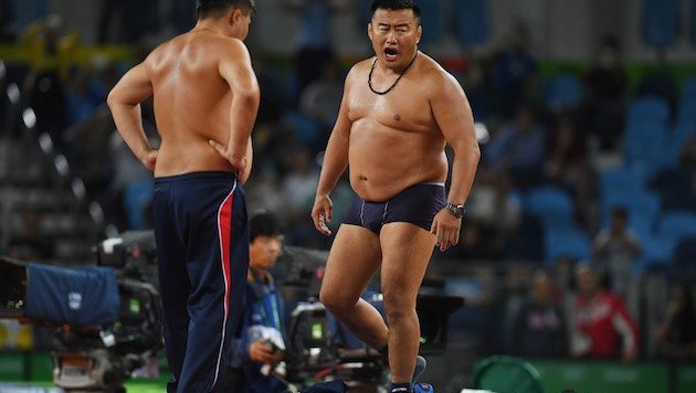 Mongolian wrestling coaches take off their clothes in protest of controversial call		Posted by	Colby Lanham