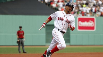 Mookie Betts of the Red Sox rounds third with one of his three home runs on Sunday