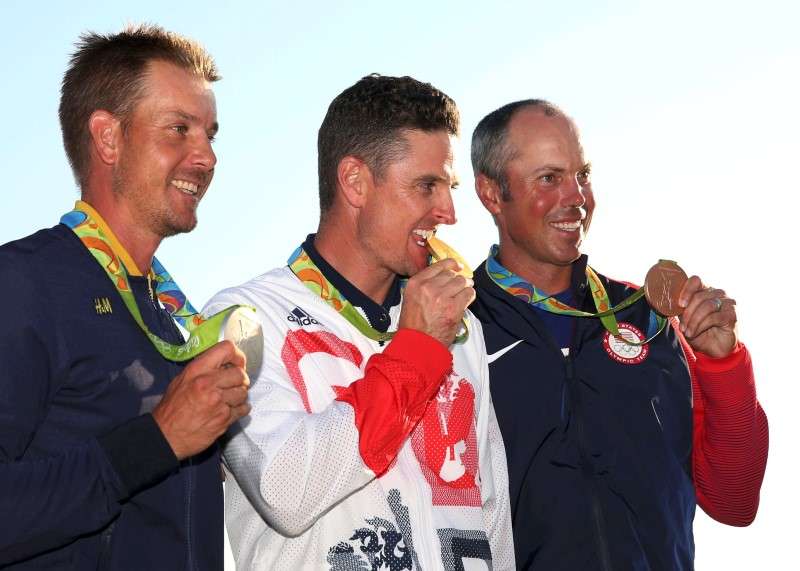 2016 Rio Olympics- Golf- Final- Men's Individual Stroke Play- Olympic Golf Course- Rio de Janeiro Brazil- 14/08/2016. Justin Rose  of Britain celebrates his gold medal win in the men's Olympic golf compeititon. At left is silver medal winn