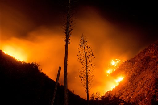 The Blue Cut fire burns in Upper Lytle Creek near Wrightwood Calif. on Friday Aug. 19 2016. Firefighters were on the offensive Friday as they worked to expand significant gains against a huge wildfire that chased thousands of people from their homes