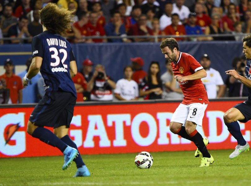 Jul 29 2015 Chicago IL USA Manchester United forward Juan Mata kicks the ball against Paris Saint Germain defender Moreira Marinho during the second half at Soldier Field. Paris Saint Germain defeats Manchester United 2-0. Mandatory Credit