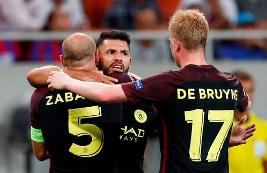 Manchester City's Sergio Aguero celebrates scoring their second goal with Pablo Zabaleta and Kevin De Bruyne