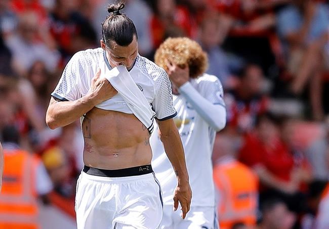 Manchester United's Zlatan Ibrahimovic front and team mate Marouane Fellaini react during the English Premier League soccer match between Bournemouth and Manchester United at Vitality Stadium in Bournemouth England Sunday Aug. 14 2016. (AP