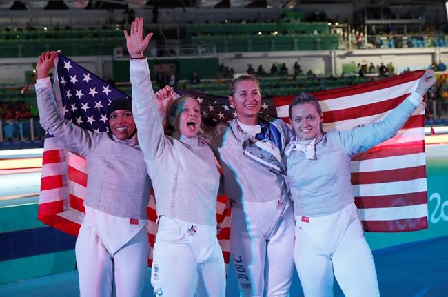 United States Women Fecing team celebrates after defeating Italy during the Bronze medal compertition in the women's team sabre fencing competition at the 2016 Summer Olympics in Rio de Janeiro Brazil Saturday Aug. 13 2016. (AP