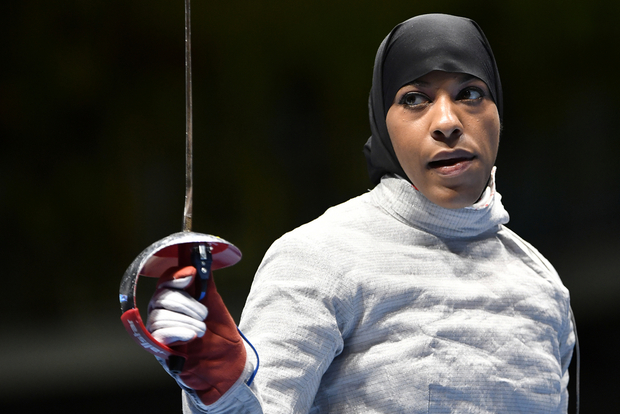 Fencer Ibtihaj Muhammad becomes the first American Olympian to compete in a hijab, wins