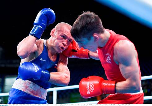 Vladimir Nikitin of Russia left exchanges punches with Michael Conlan of Ireland during their Bantamweight quarter final bout