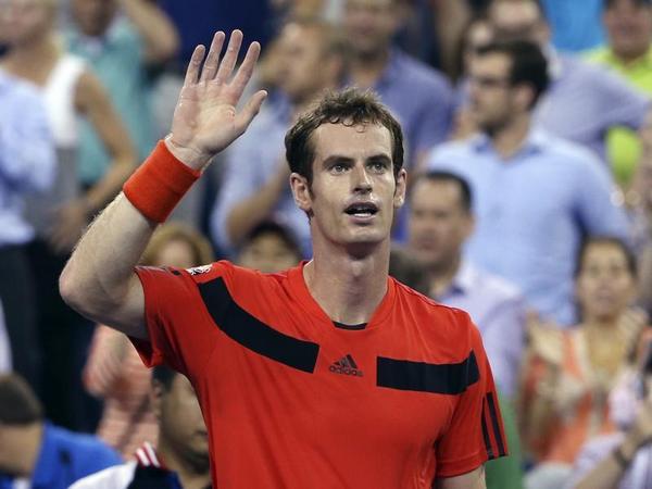 Andy Murray of Britain waves to the crowd after defeating Michael Llodra of France at the U.S. Open tennis championships in New York