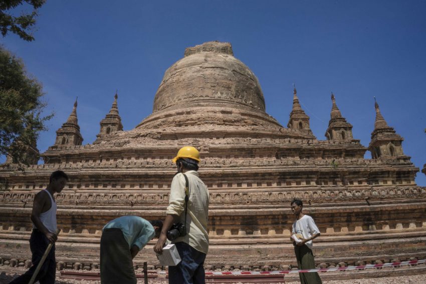 Workers set a security line around the earthquake-damaged Sitanagyi Pagoda in Bagan as they survey the extent of the damage