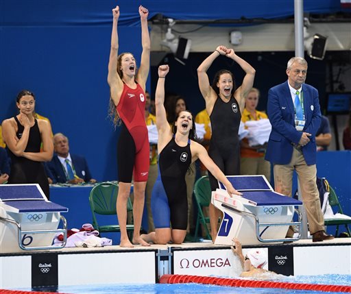 Canada's Taylor Ruck from second left Brittany MacLean Katerine Savard and Penny Oleksiak celebrate their bronze in the women's 4 x 200-meter freestyle relay final during the swimming competitions at the 2016 Summer Olympics in Rio de Janeiro on Thursd