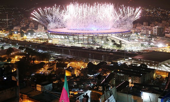 RIO DE JANEIRO BRAZIL- AUGUST 05 Fireworks explode over Maracana stadium with the Mangueira 'favela&#039 community in the foreground during opening ceremonies for the Rio 2016 Olympic Games