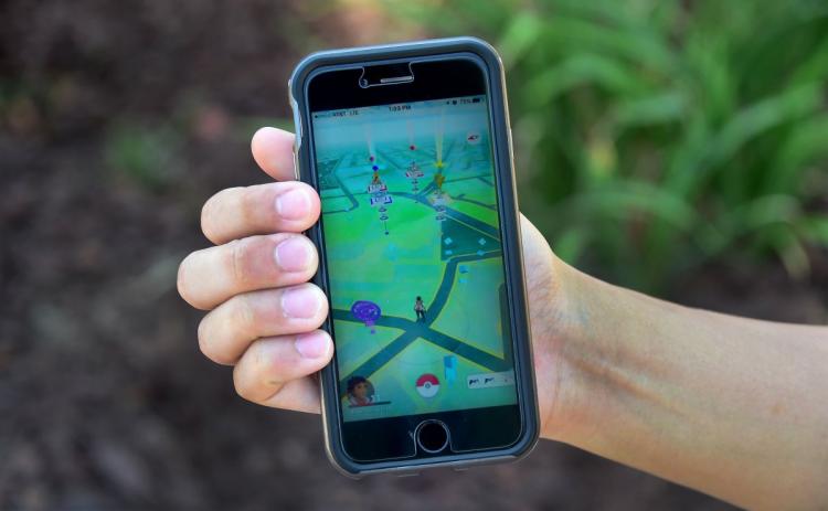 Eric Lee displays the game Pokemon Go on his cellphone. The location-based augmented reality mobile game was released on July 6th