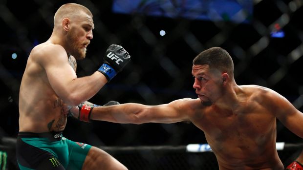 Nate Diaz right punches Conor Mc Gregor during UFC 202