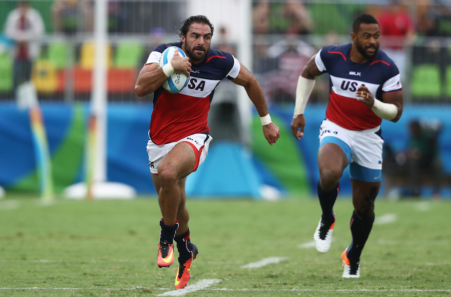 Nate Ebner of the United States on his way to scoring a try during the U.S. team's match against Fiji at Deodoro Stadium in Rio de Janeiro Aug. 10 2016