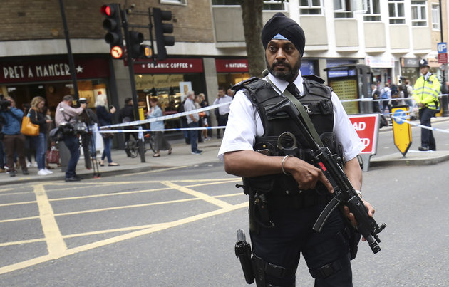 Neil Hall  Reuters
An armed officer stands guard at the scene of the knife attack in Russell Square in London