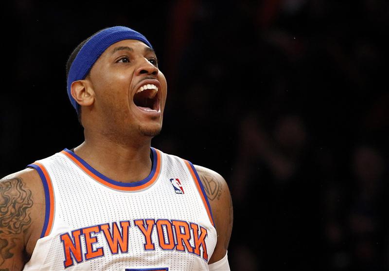 New York Knicks forward Carmelo Anthony reacts after hitting a three-point shot against the Boston Celtics in the first quarter of Game 1