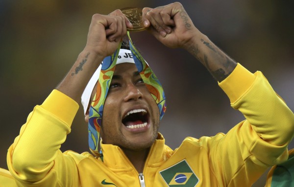 Neymar of Brazil poses with his gold medal