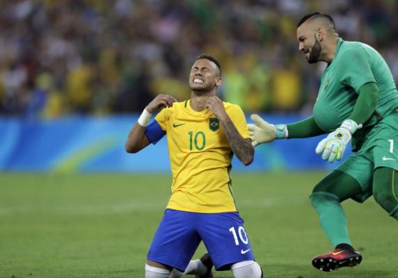 Brazil's Neymar cries as he kneels down