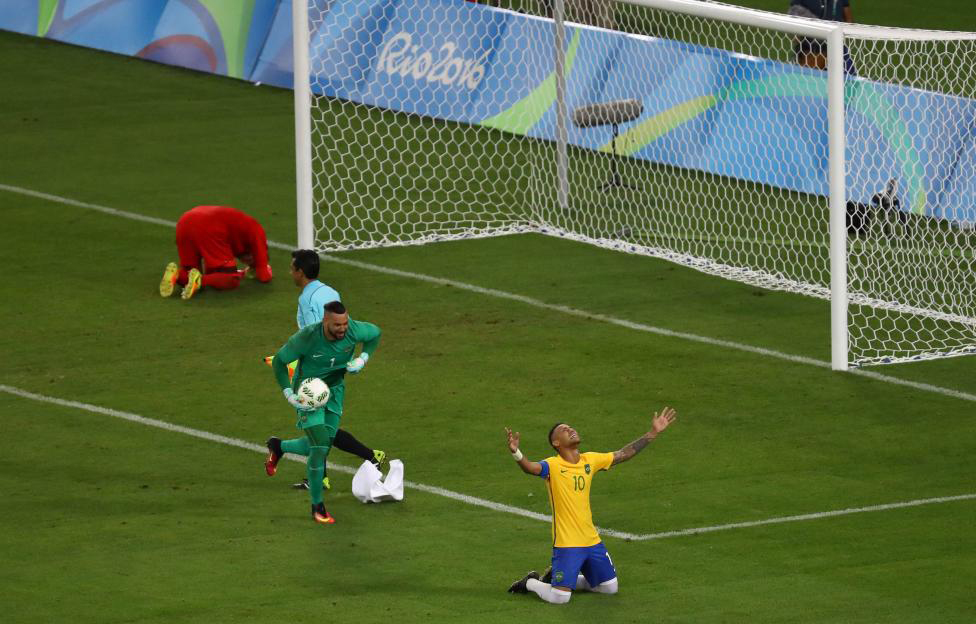 Neymar of Brazil celebrates with goalkeeper Weverton after they won the penalty shootout and the gold medal. REUTERS  Leonhard Foeger