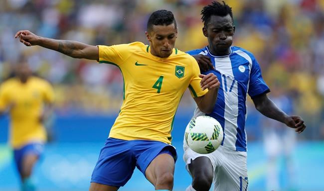 Brazil's Marquinhos left and Honduras&#39 Alberth Elis vie for the ball during a semi-final match of the men's Olympic football tournament between Brazil and Honduras at the Maracana stadium in Rio de Janeiro Brazil Wednesday Aug. 17 2016. B