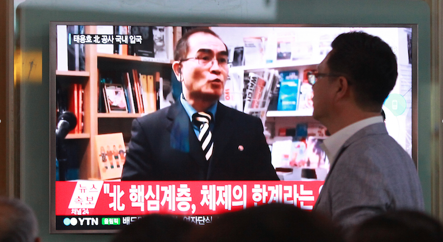 People watch a TV news program showing a file image of Thae Yong Ho minister at the North Korean Embassy in London in Seoul South Korea Wednesday. Pic AP