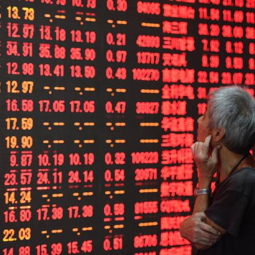 News Agency an investor stares at a stock price board at a stock trading hall in Hangzhou capital of east China's Zhejiang Province. China’s Cabinet approved a long-awaited initiative