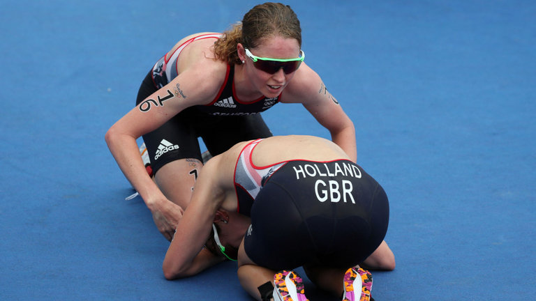 Non Stanford and Holland embrace after the triathlon