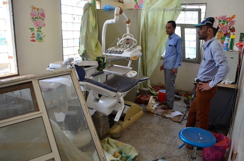 Yemenis inspect the damage in a room at a hospital operated by the Paris-based aid agency Doctors Without Borders in Abs in the northern province of Hajjah on Tuesday